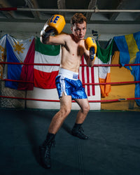 variant:blue/white::TITLE Boxing Professional Traditional Cut Trunks boxing right hook yellow gloves