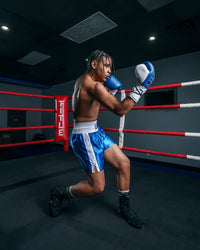 variant:blue/white::TITLE Boxing Professional Traditional Cut Trunks boxing right hook