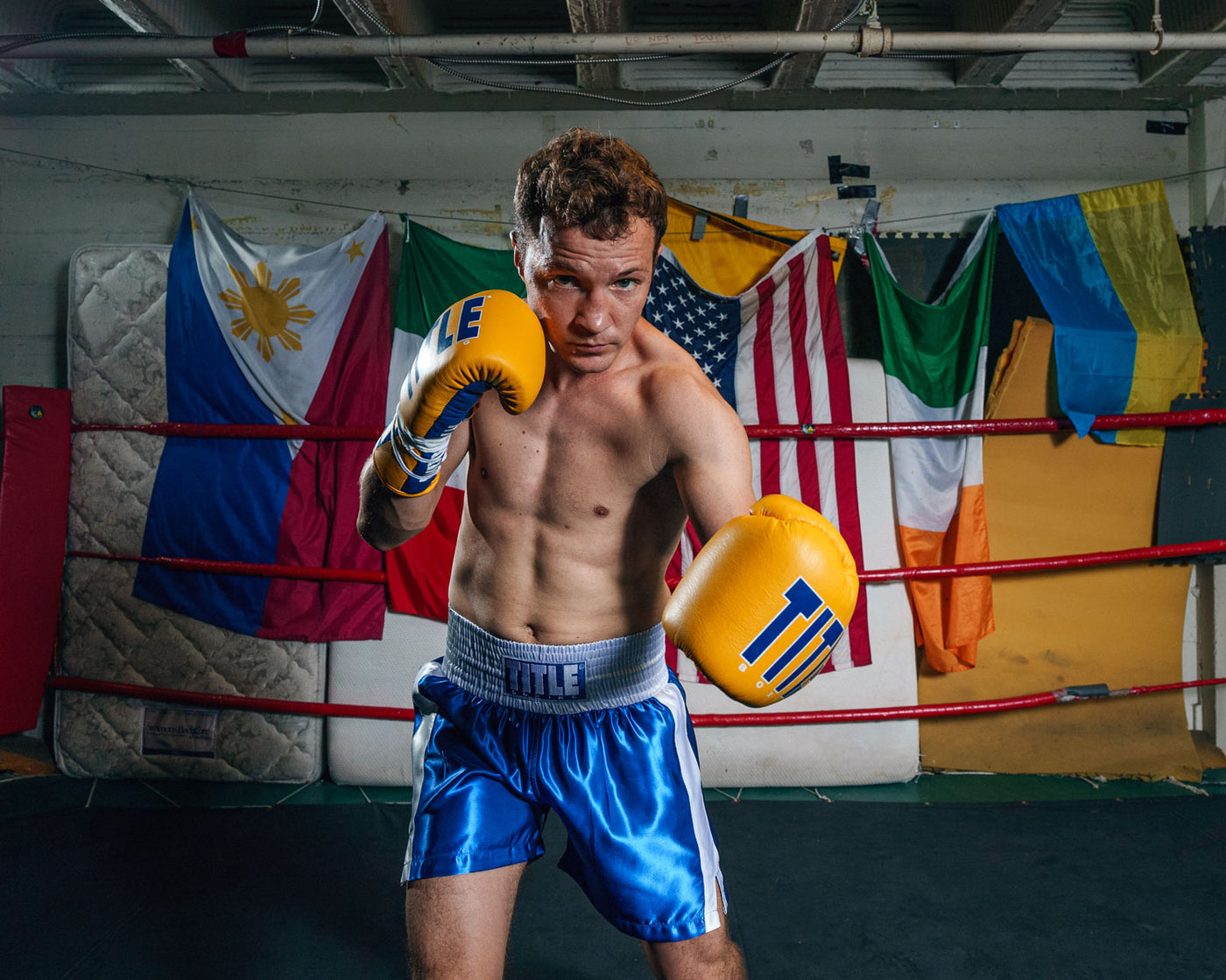variant:blue/white::TITLE Boxing Professional Traditional Cut Trunks boxing left jab yellow gloves