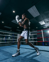 variant:white/black::TITLE Boxing Professional Traditional Cut Trunks boxer stance