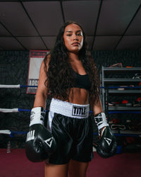 variant:black/white::TITLE Boxing Professional Women’s Satin Striped Boxing Trunks girl with hands down
