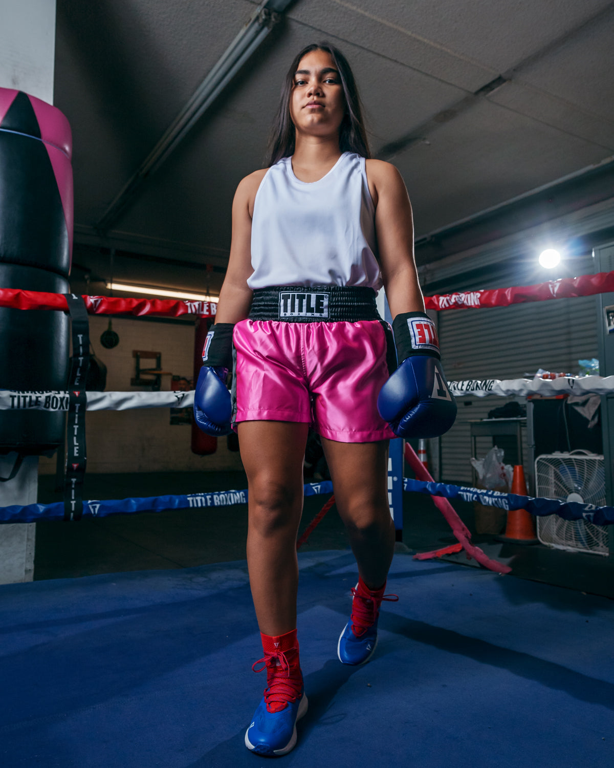 variant:pink/black::TITLE Boxing Professional Women’s Satin Striped Boxing Trunks girl standing in ring