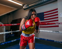 variant:red/white::TITLE Boxing Professional Women’s Satin Striped Boxing Trunks boxing pose