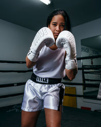 variant:white/black::TITLE Boxing Professional Women’s Satin Striped Boxing Trunks girl boxing pose