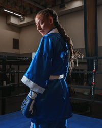 variant:blue/white::TITLE Boxing Stock Fingertip Robe 2.0 girl in robe looking back
