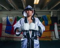 variant:white/black::TITLE Boxing Stock Full Length Robe 3.0 guy front view hands together hood up