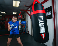 variant:Blue/White::TITLE Boxing Pro Style Leather Training Gloves 3.0 girl hitting bag