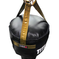 variant:Black/Gold::TITLE Boxing Made in the USA Angled Punching Bag closeup of hanging straps