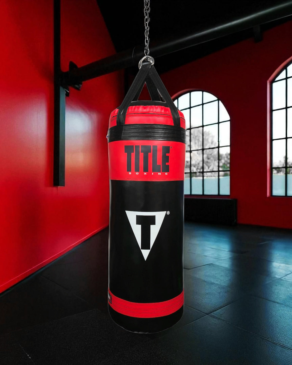 variant:Black/Red::TITLE Boxing Made in the USA 135lb Punching Bag hanging in gym
