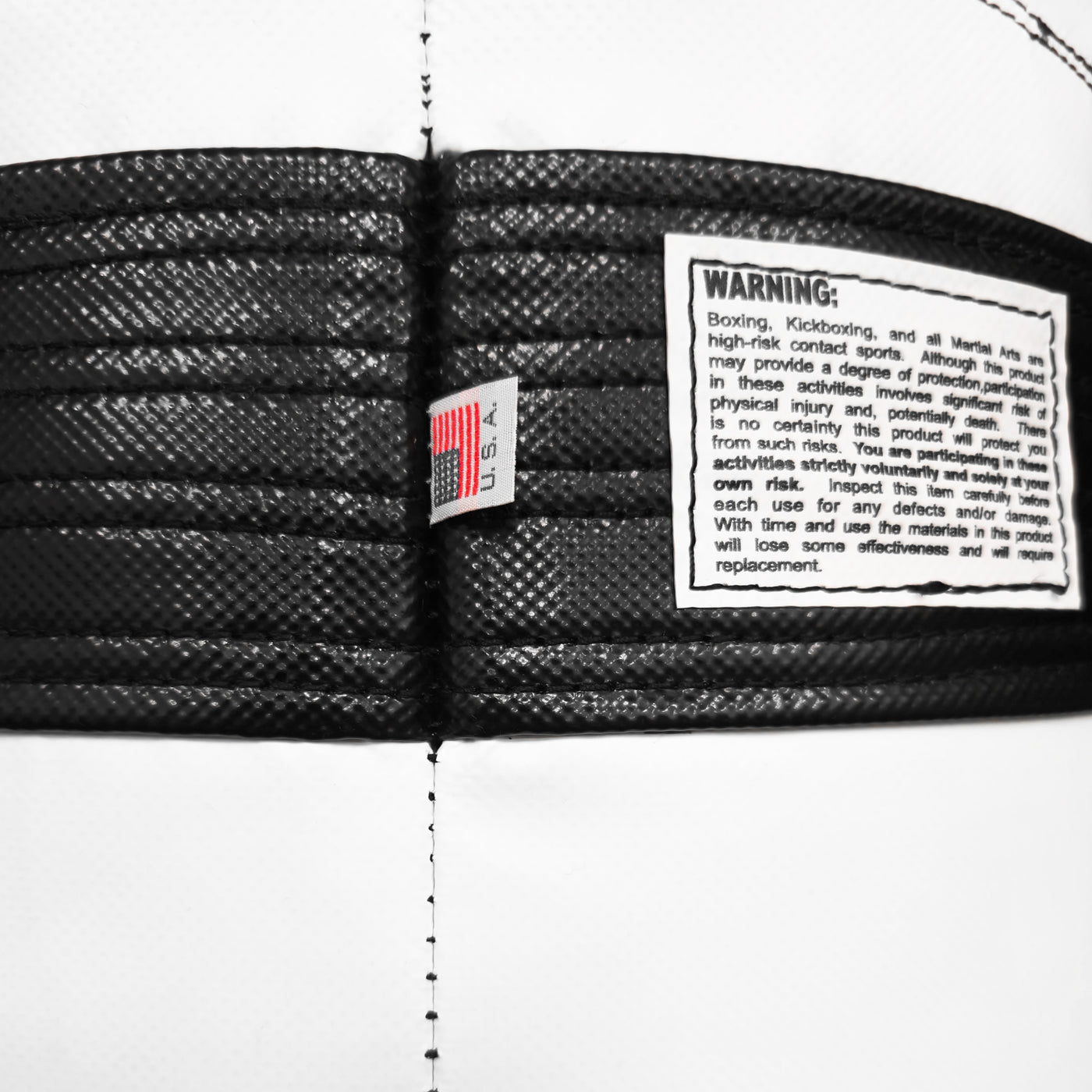 variant:Black/White::TITLE Boxing Made in the USA 135lb Thai Heavy Bag closeup of tags