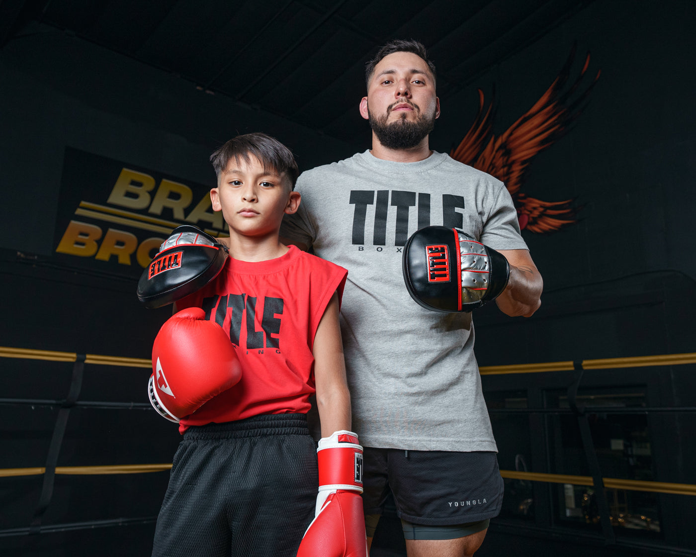 variant:lifestyle::TITLE Boxing Valiant Micro Mitts coach and boxer 