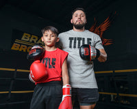 variant:lifestyle::TITLE Boxing Valiant Micro Mitts coach and boxer 