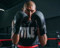 variant:Black::Viper by TITLE Boxing Select Training Gloves 2.0 guy posing in the gloves