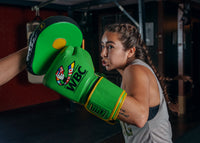 variant:Green/Black::WBC by TITLE Boxing Bag Gloves man wearing gloves mitt left hook coach