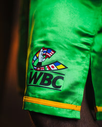 variant:Green/Black::WBC by TITLE Boxing Professional Boxing Trunks closeup of WBC logo