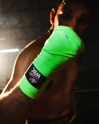 variant:Green/Black::WBC by TITLE Boxing Hand Wraps on boxer's hands closeup