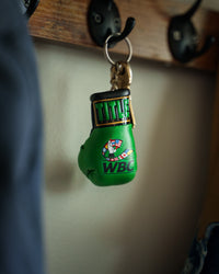 variant:lifestyle::WBC by TITLE Boxing Keyring hanging on hook