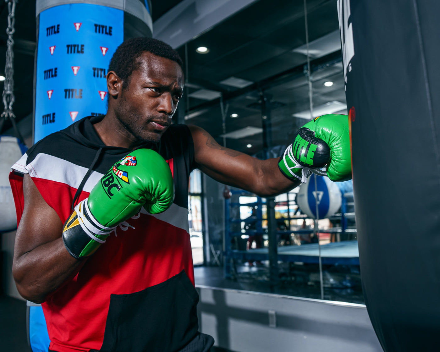 variant:green/black::WBC by TITLE Boxing Pro Fight Leather Gloves boxer left jab from front