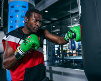 variant:green/black::WBC by TITLE Boxing Pro Fight Leather Gloves boxer left jab from front