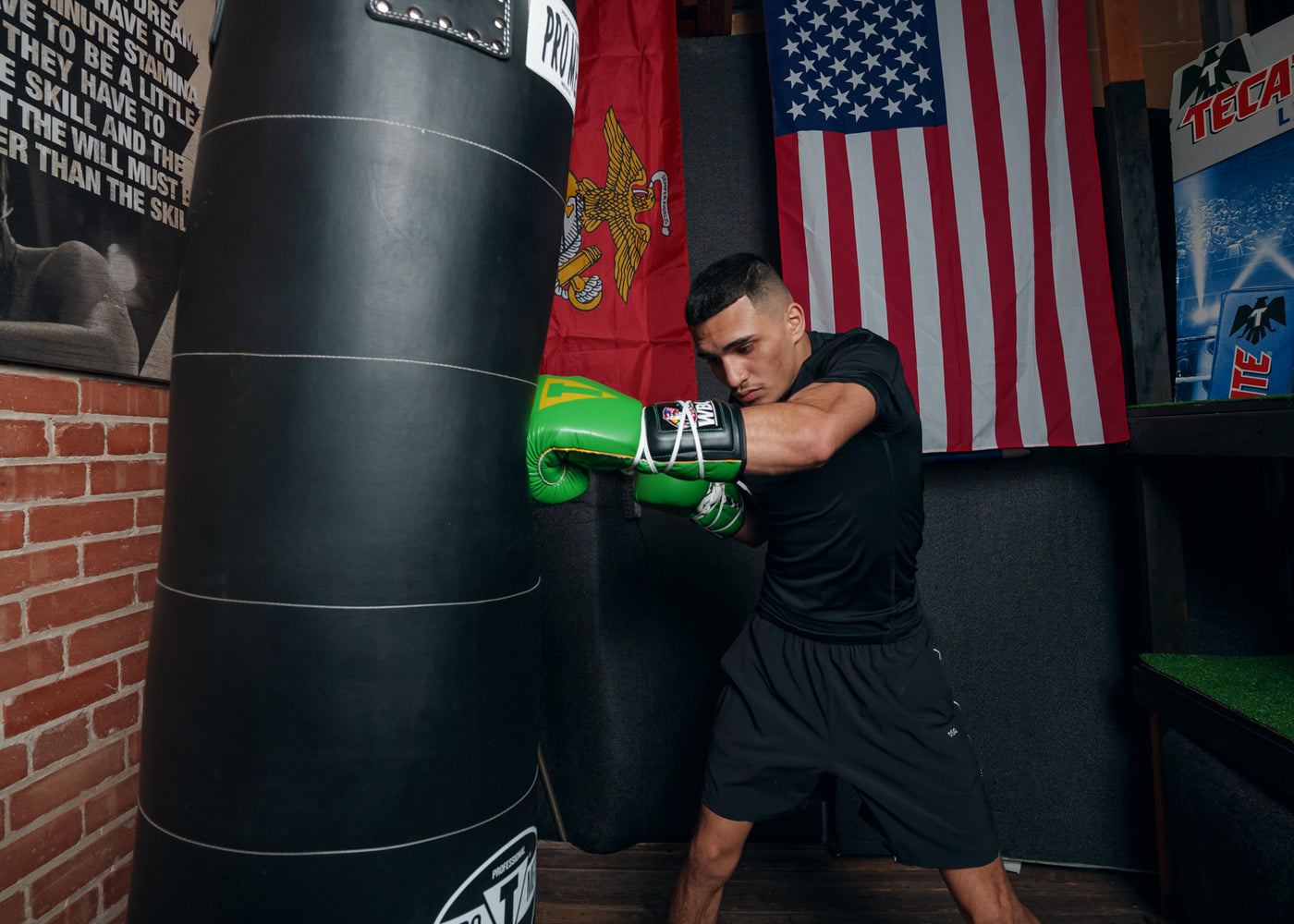 variant:Green/Black::WBC by TITLE Boxing Sparring Gloves man hitting bag left jab