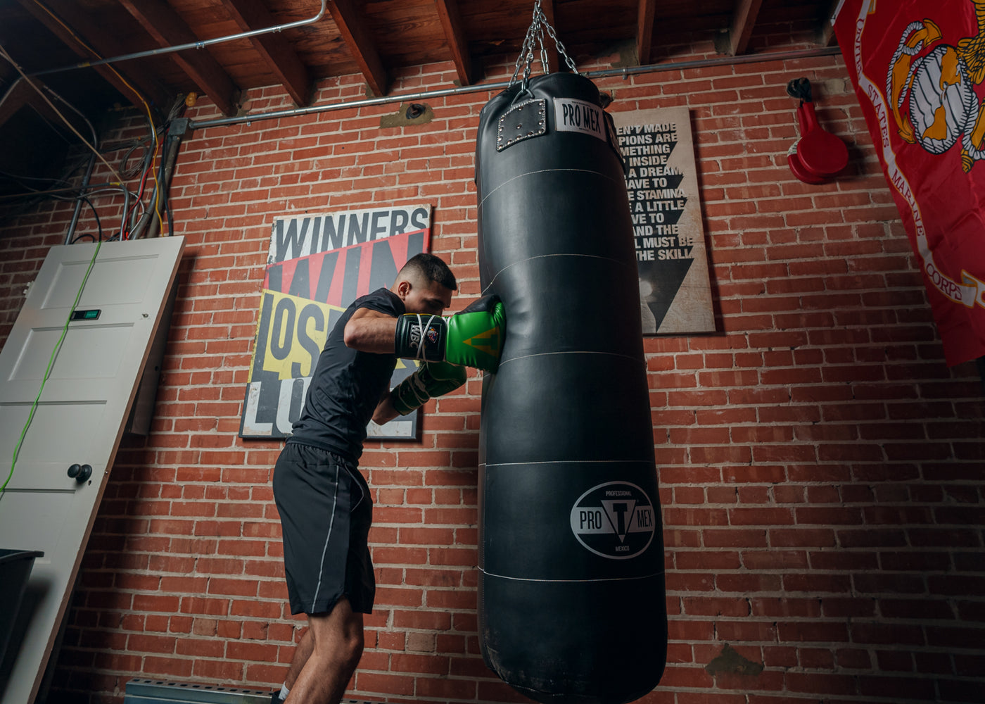 variant:Green/Black::WBC by TITLE Boxing Sparring Gloves man hitting bag right jab