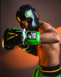 variant:Black/Green::WBC by TITLE Boxing Sparring Gloves on fighter in boxing stance 
