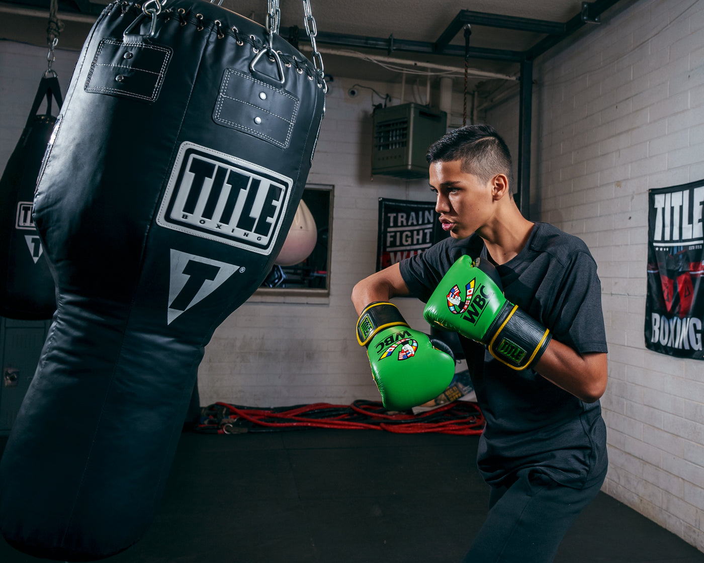variant:Green/Black::WBC by TITLE Boxing Training Gloves kid hitting bag