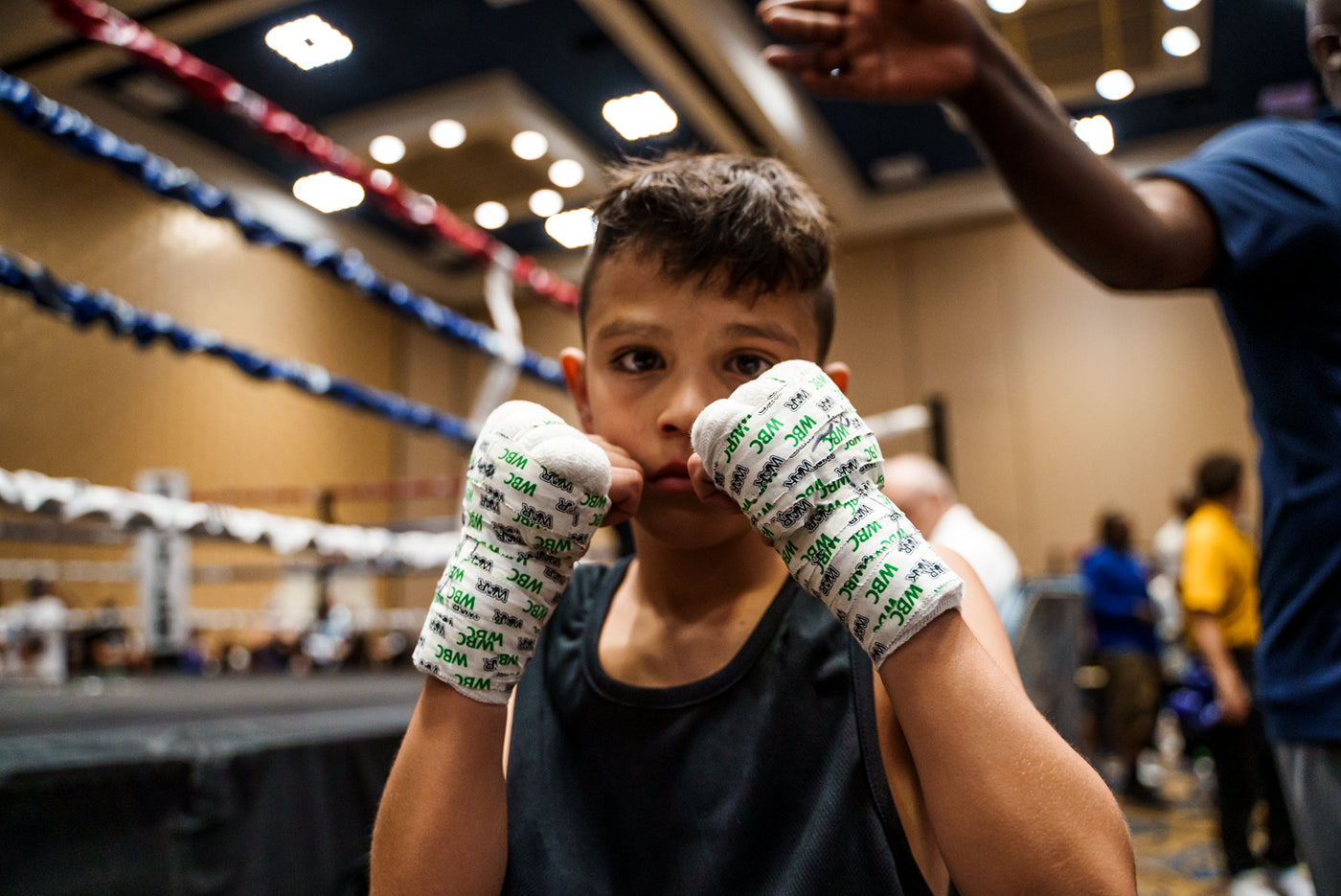 variant:lifestyle::WBC by TITLE Boxing 1” Tape over gauze on a young boxer's hands