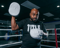 variant:Lifestyle::TITLE White Punch Mitts 2.0 mitt in air
