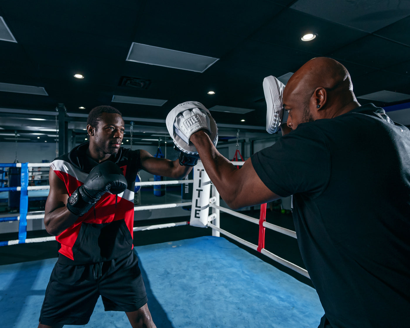 variant:Lifestyle::TITLE White Punch Mitts 2.0 mitts with coach