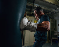variant:lifestyle::TITLE White Boxing Training Gloves 2.0  guy left jab