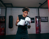 variant:lifestyle::TITLE White Boxing Gloves kid boxing stance