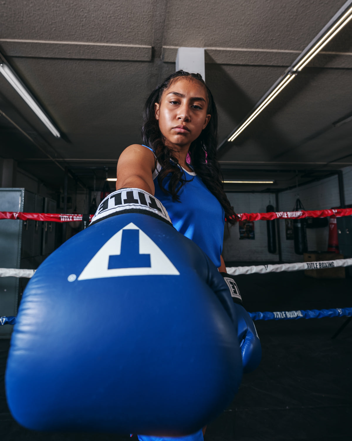 variant:Red/Blue::TITLE boxing Women's Reversible Elite Amateur boxing set blue side on female fighter