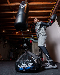 variant:lifestyle::TITLE Boxing Wave H2O Universal Bag Anchor in use in a boxing gym