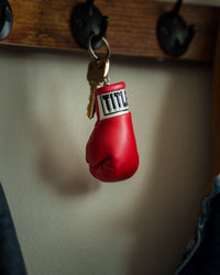 variant:red::TITLE Boxing Excel Glove Keyring hanging on hook
