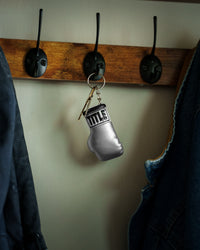 variant:silver::TITLE Boxing Excel Glove Keyring hanging on hook