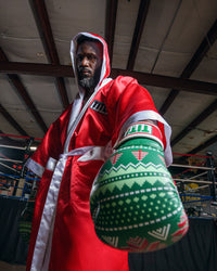 variant:green::TITLE Boxing Limited Edition Deck the halls bag gloves left hand down close up glove