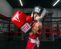 variant:black::TITLE Boxing Aerovent Elite USA Boxing Competition Headgear – With Cheeks kid in ring 