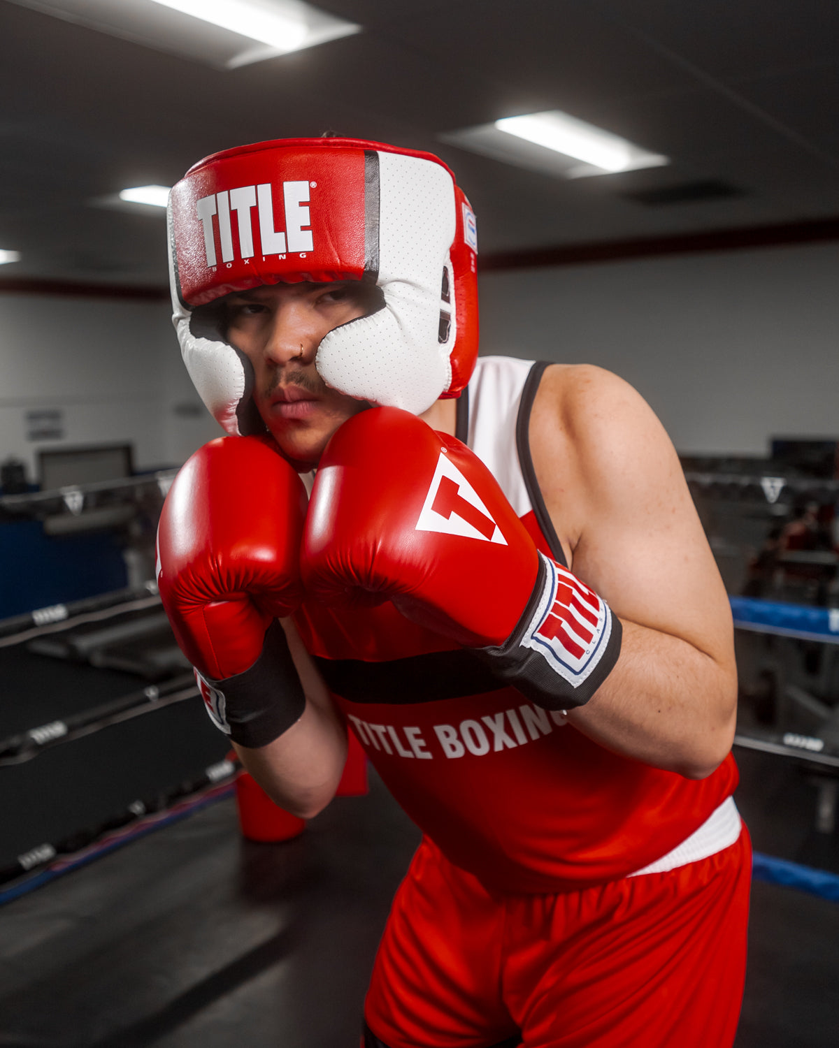 variant:red::TITLE Boxing Aerovent Elite USA Boxing Competition Headgear – With Cheeks man posing