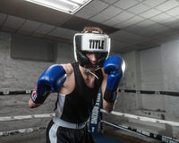 variant:white::TITLE Boxing Aerovent Elite USA Boxing Competition Headgear – With Cheeks guy in ring