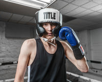 variant:white::TITLE Boxing Aerovent Elite USA Boxing Competition Headgear – With Cheeks guy holding up a glove