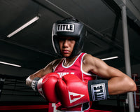 variant:black::TITLE Boxing USA Boxing Competition Headgear - Open Face kid hands together 