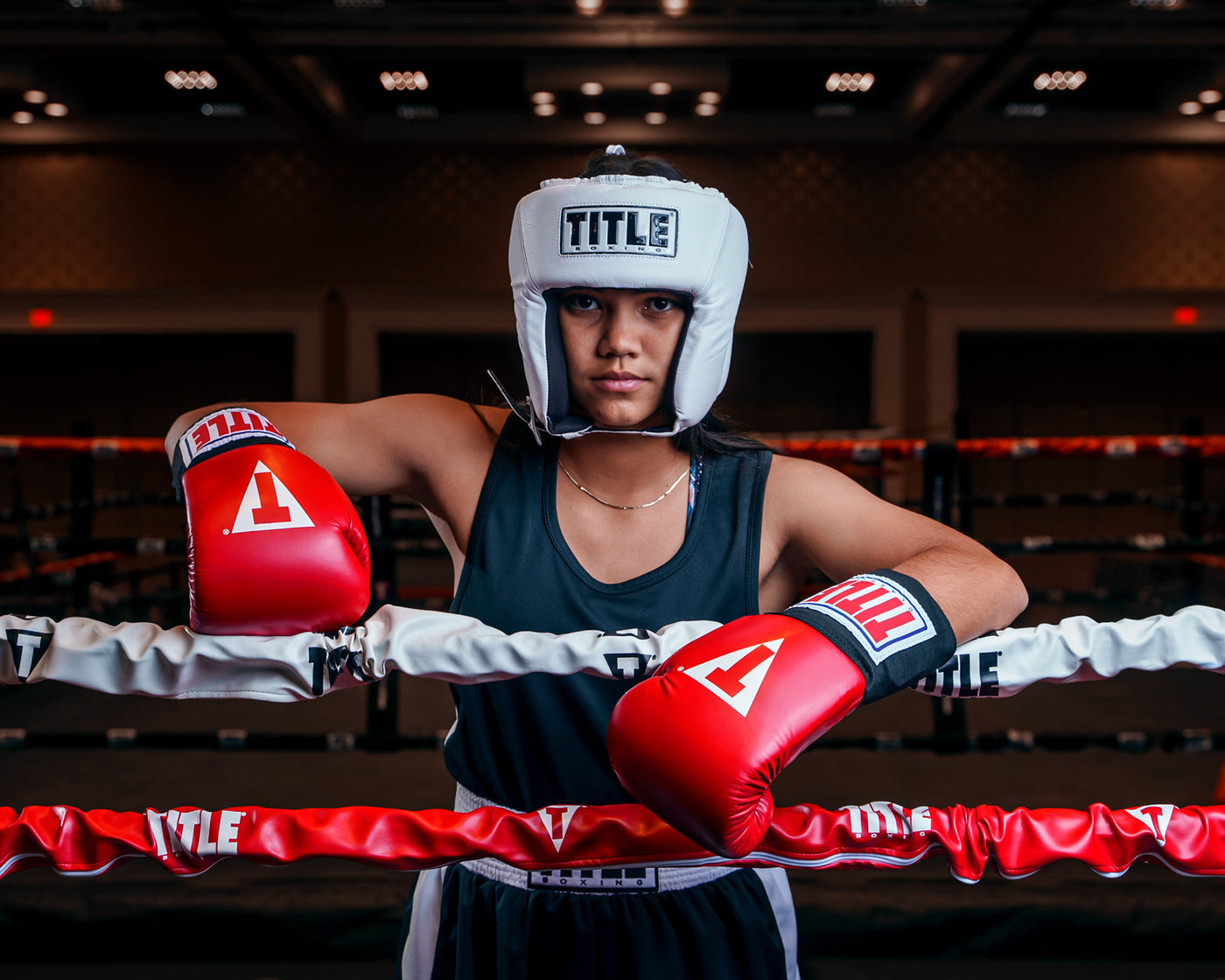 variant:white::TITLE Boxing USA Boxing Competition Headgear - Open Face kid standing in the ring hands on rope