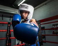 variant:white::TITLE Boxing USA Boxing Competition Headgear - Open Face kid throwing left jab with blue gloves