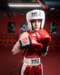 variant:white::TITLE Boxing USA Boxing Competition Headgear - Open Face kid white headgear and red outfit