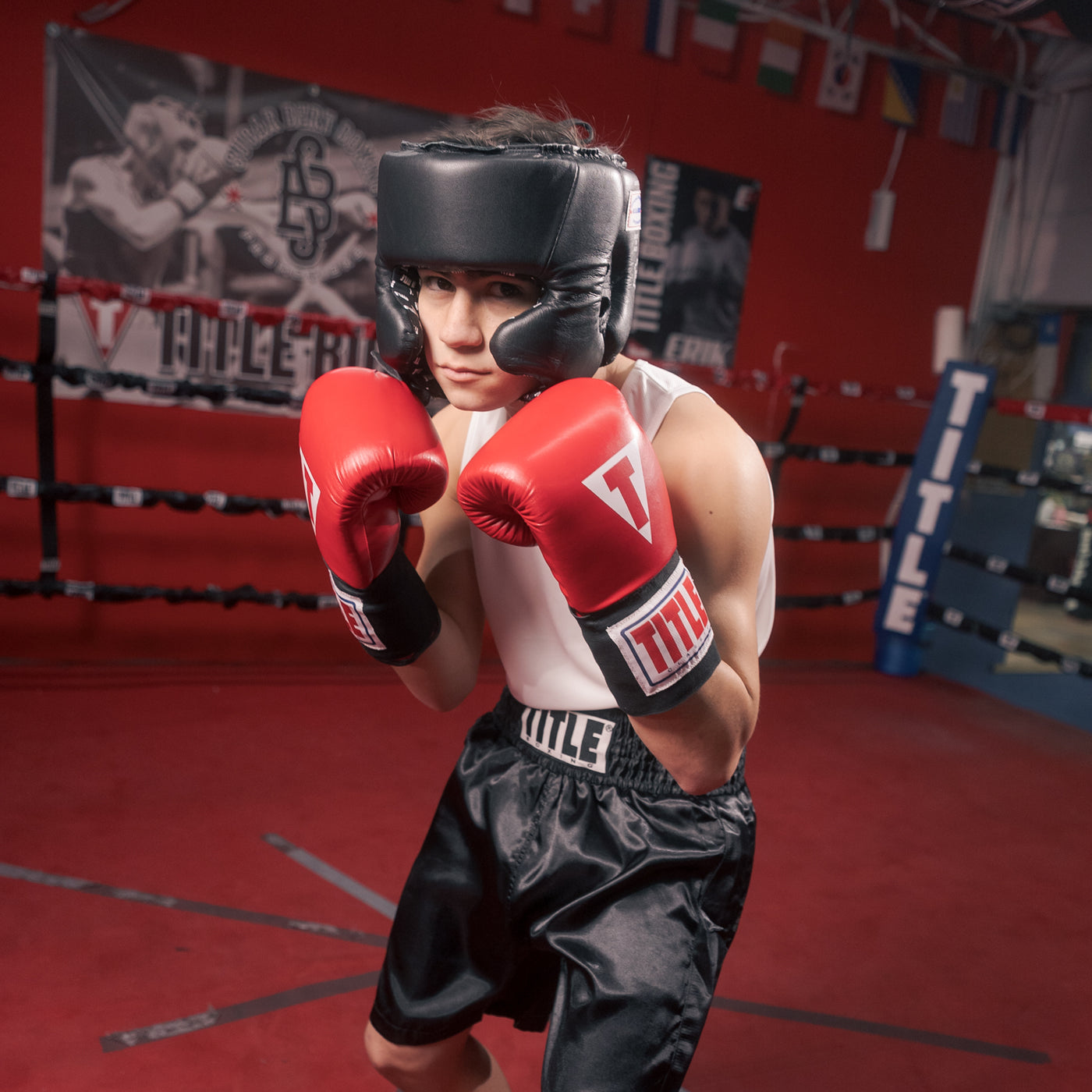 variant:blank black::TITLE Boxing USA Boxing Competition Headgear - With Cheeks guy standing in ring