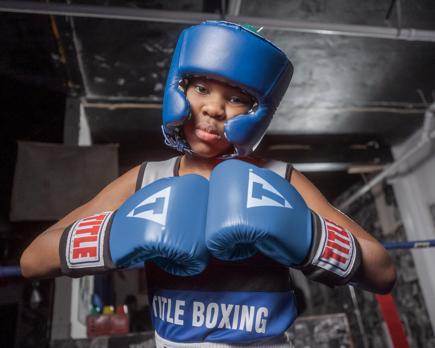 variant:blank blue::TITLE Boxing USA Boxing Competition Headgear - With Cheeks kid holding hands together