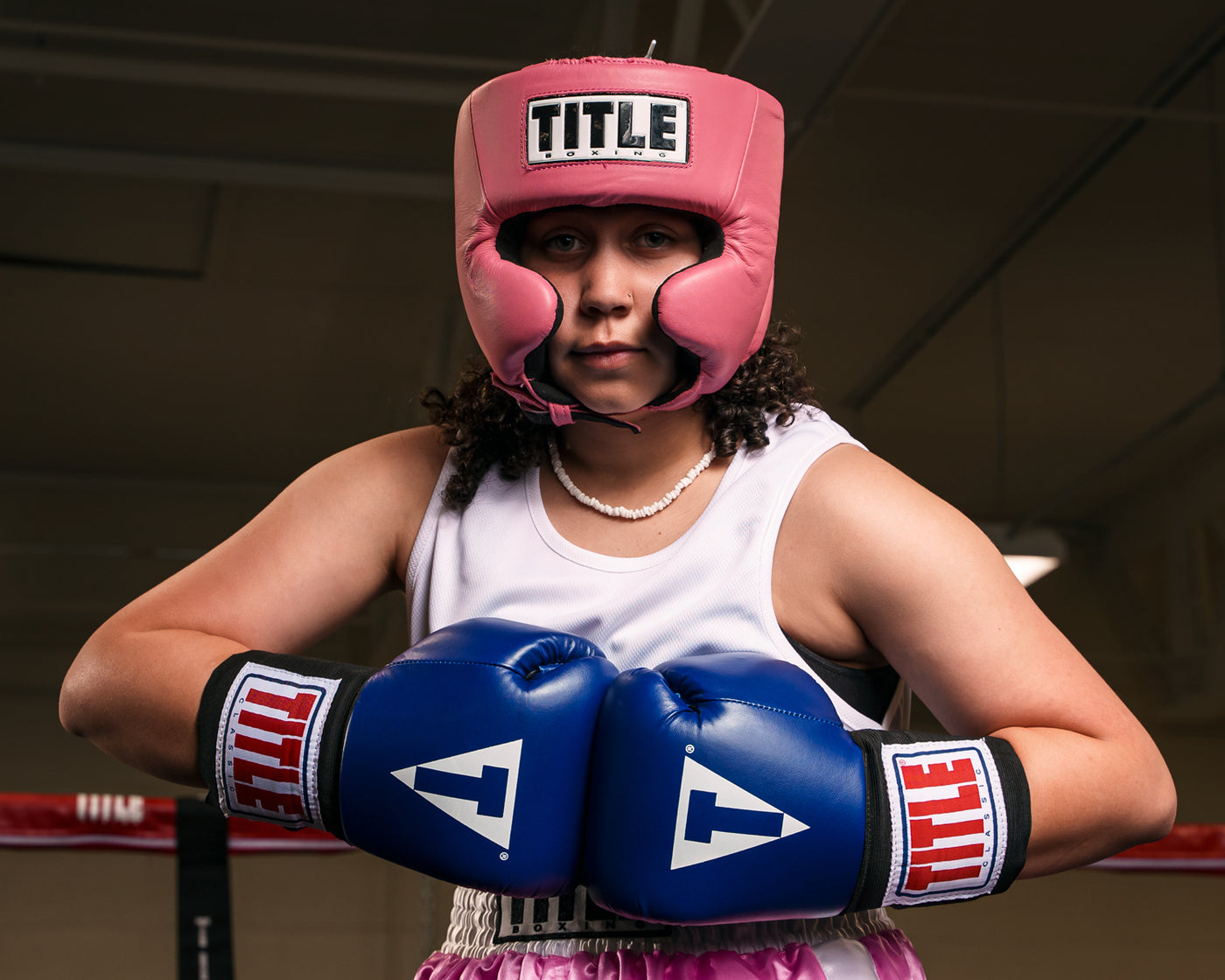 variant:pink::TITLE Boxing USA Boxing Competition Headgear - With Cheeks girl in ring hands together
