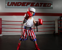 variant:Blank Red/White/Blue::TITLE Boxing USA Boxing Competition Headgear - With Cheeks kid posing in ring