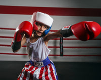 varaint:Blank Red/White/Blue::TITLE Boxing USA Boxing Competition Headgear - With Cheeks kid throwing left punch